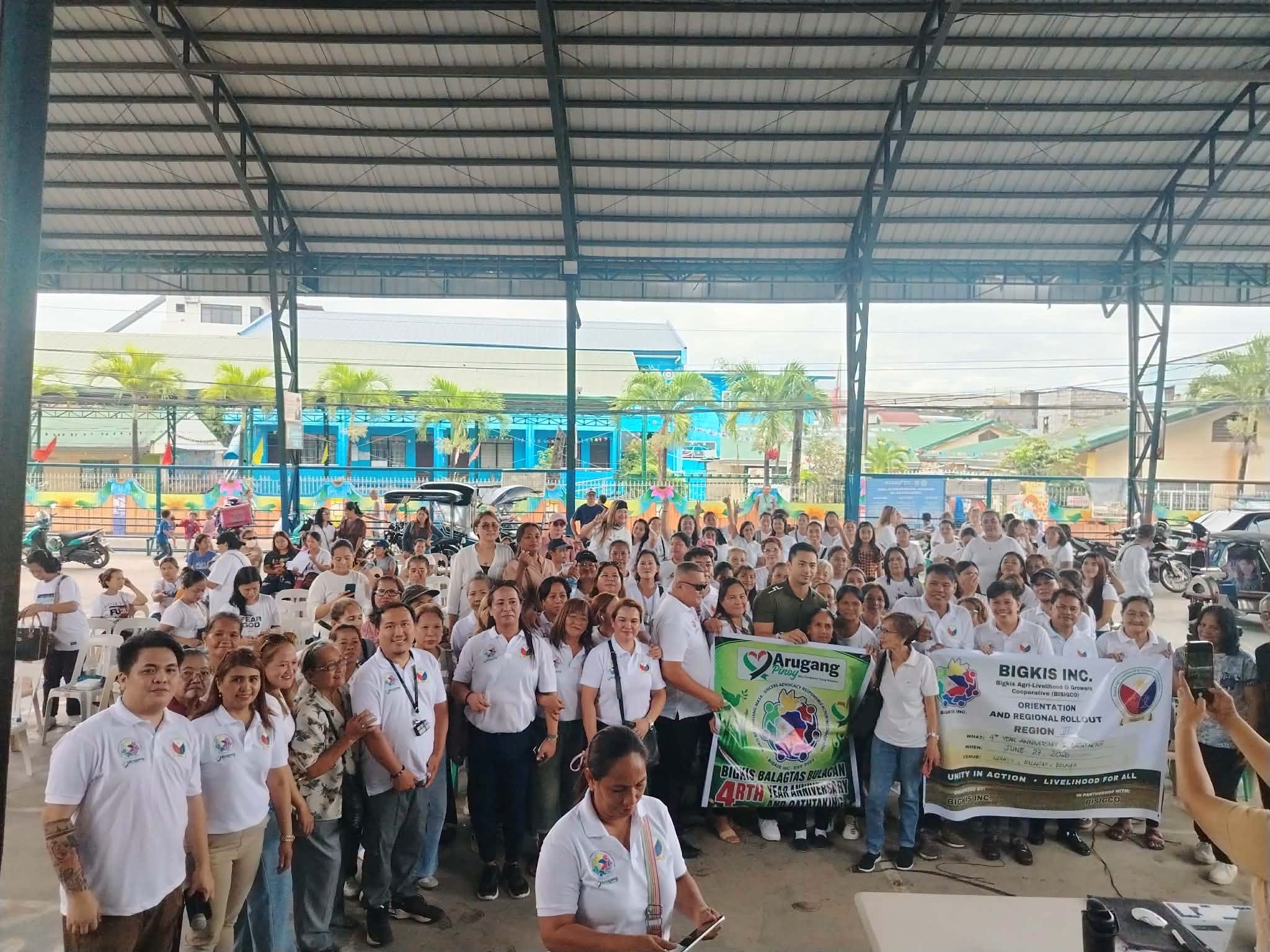 A general assembly of BIGKIS members under a covered court